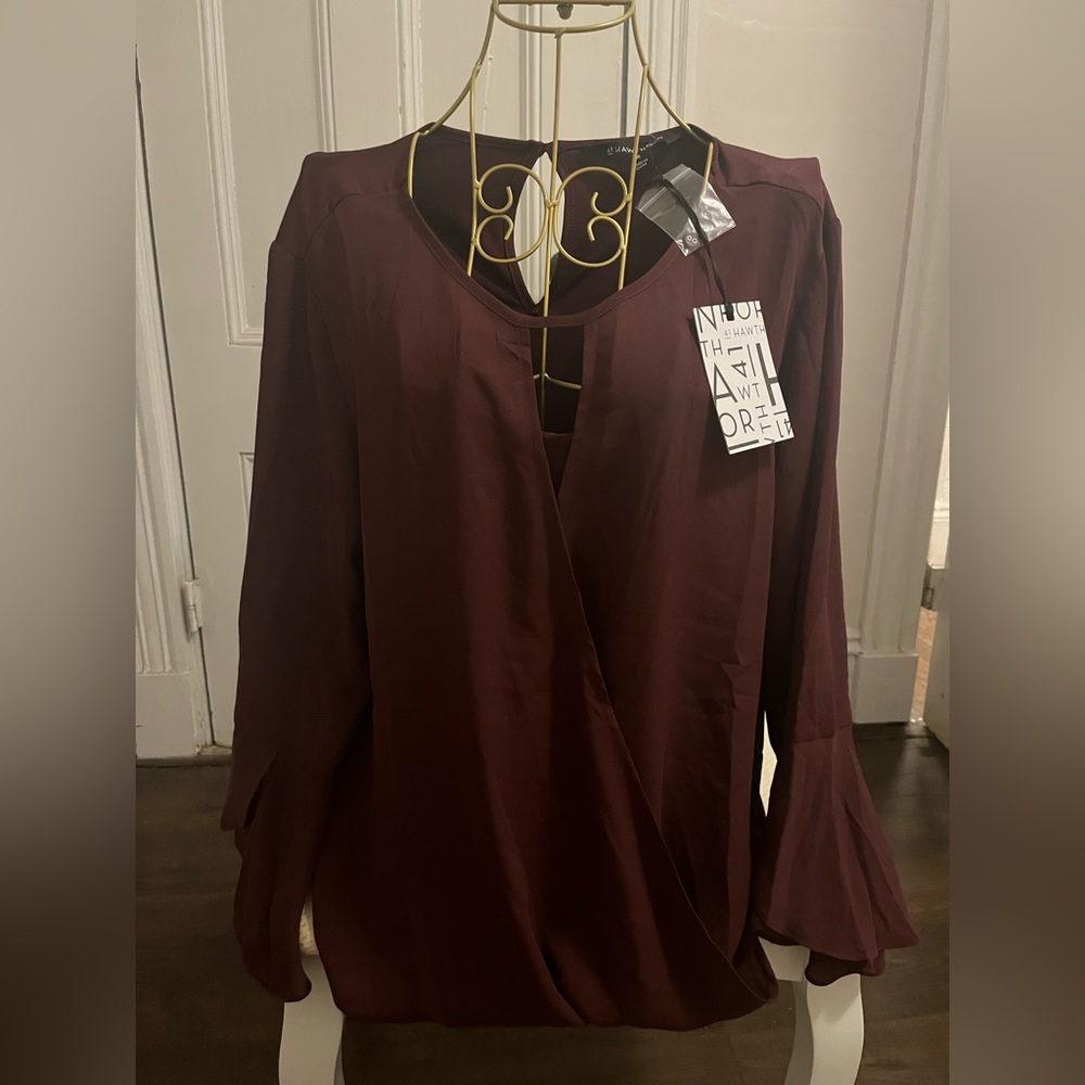 Woman maroon blouse.